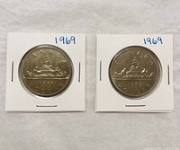 Both 1969 Canada dollar coins in flips