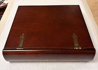 top view of closed cherry wood box showing rounded front edge