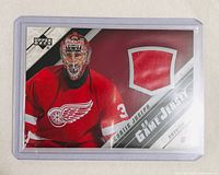 Front view of Upper Deck UD Game Jersey card showing Curtis Joseph image and red jersey swatch in plastic holder