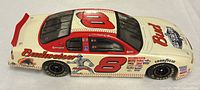 Top and right side of diecast car showing number 8 and Budweiser graphics