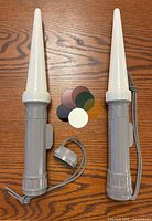 Both flashlights with cones, lanyards, end cap, six filter discs