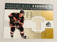 Front of Authentic Fabrics card showing Jonathan Toews image, jersey swatch and set branding