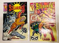 Both Solarman comics side by side in bags