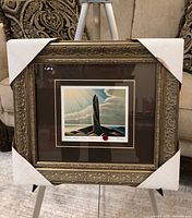 Front view of framed print with corner protectors