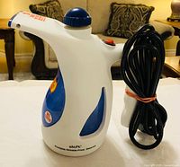 Side view of Shift handheld steamer showing brand, form factor and power cord