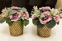 Both matching faux rose centerpieces front view
