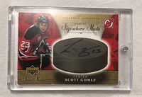 Front of 2006-07 Upper Deck Sweet Shot Scott Gomez autographed card in plastic holder