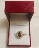Ring in open presentation box showing full piece