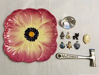 Group shot of all items: Beswick dish, crystal diamond, McCowans hammer, eight charms