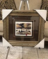 Full view of framed print with protective corner covers