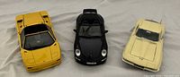 Front view of three model cars side by side