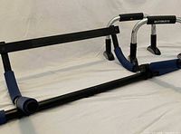 Pull-up bar and push-up bars laid out on surface