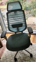 Front view of Branch ergonomic chair showing mesh seat, back, headrest and armrests