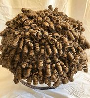 Exterior view of dark brunette wig with dense corkscrew curls