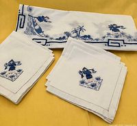 Folded napkins and tablecloth showing embroidery detail