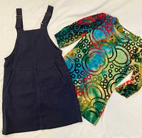Toad & Co navy pinafore skirt and Violet Ruby patterned top displayed side by side