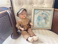 Group shot showing doll, bugle, framed print