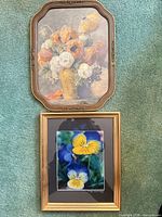 Two framed floral prints with glass glazing in wood frames