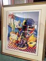 Full view of framed print in gold frame