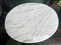 Overhead view of white marble tabletop showing veining pattern