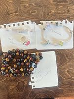 All four jewellery pieces laid out and labelled