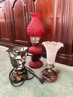 All three lamps side by side showing shades, bases, cords, materials and colors