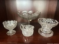 Group shot showing all four pressed glass pieces