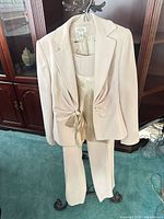 Full view of Talbots beige 3-piece suit on hanger showing jacket, satin shell and pants