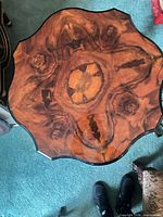 Top view showing burl veneer pattern and scalloped edge