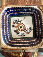 Front view of ceramic plate showing hand-painted design and colors