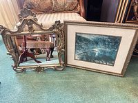 Front view of ornate gold wall mirror and rectangular framed print, shows design, colour and condition