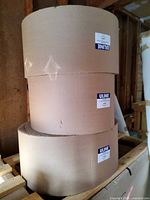 Three stacked Uline corrugated wrap rolls