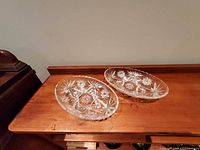 Two oval Anchor Hocking Star of David pressed-glass relish dishes