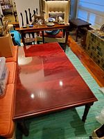 Full view of rectangular flame mahogany coffee table