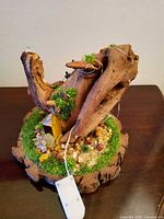 Driftwood and crystal diorama with LED battery pack visible