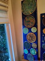 Full view of the mixed media panel leaned against wall