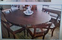 table with chairs around it fully visible