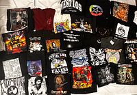 Full lot of 27 graphic T-shirts laid flat