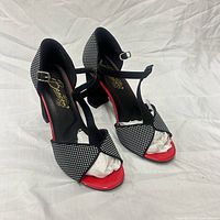 Front angled view of both shoes showing design, color, and condition