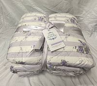 Folded Lavender Jewel quilt with ribbon and tag