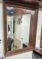 Full view of rectangular wall mirror on wall