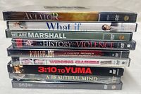 Stacked view showing all nine sealed DVD titles