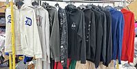 Front view of all 11 hoodies on hangers