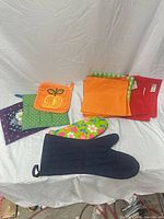 Group shot showing oven mitts and napkins