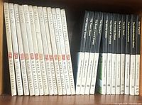 Shelf view showing 12 white-spined Life World Library books and adjacent black Library of the Americas books