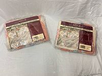 Two sealed Arch Quilts Heirloom Collection quilts side by side.