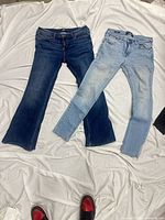 Full view of both jeans laid flat