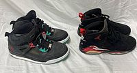 Both pairs of sneakers side by side top view highlighting uppers and lacing