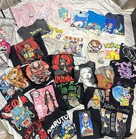 All 30 anime T-shirts laid out showing fronts