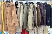 All eight jackets hanging on rack